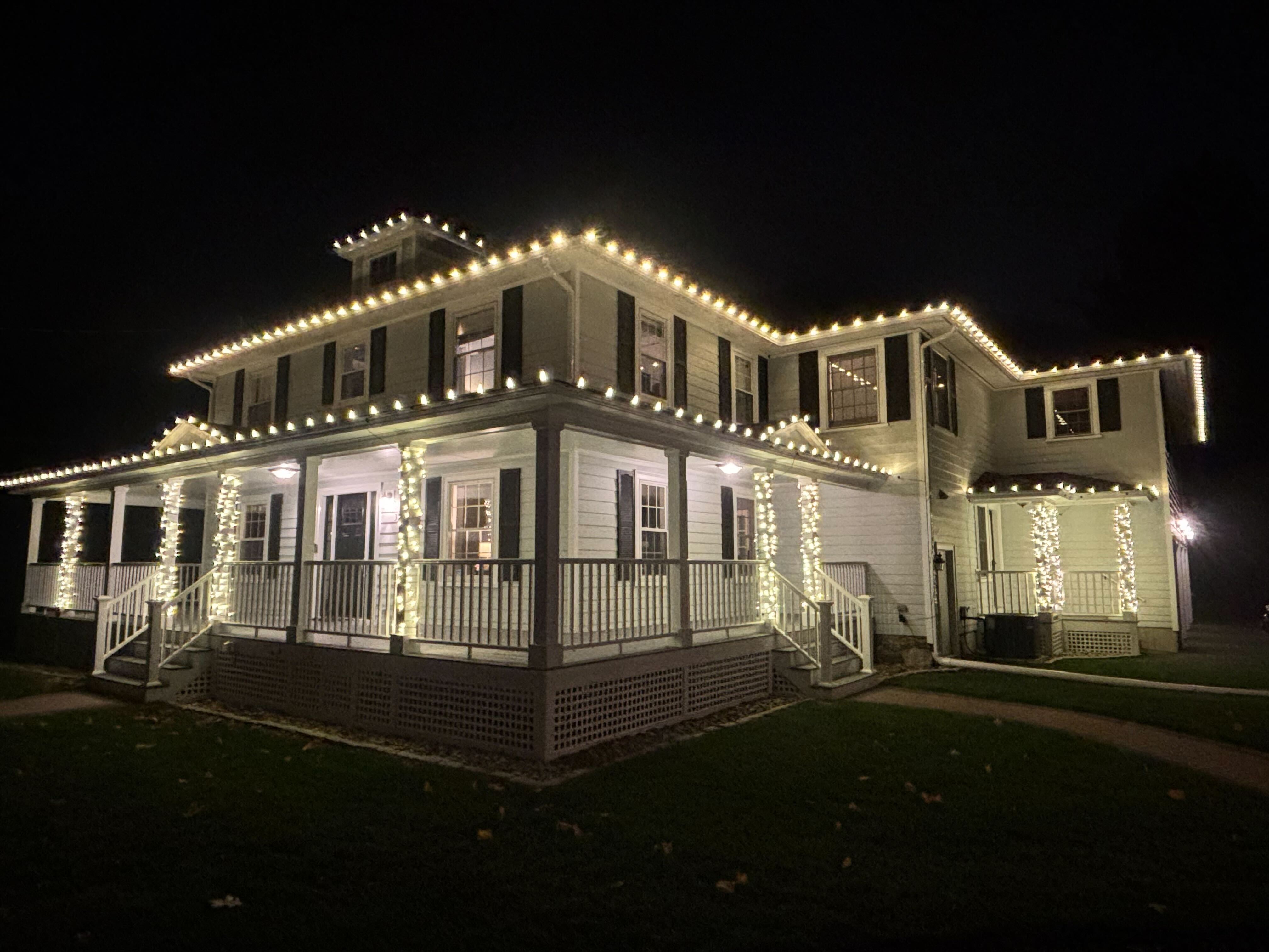 A picture of a house with christmas lights
