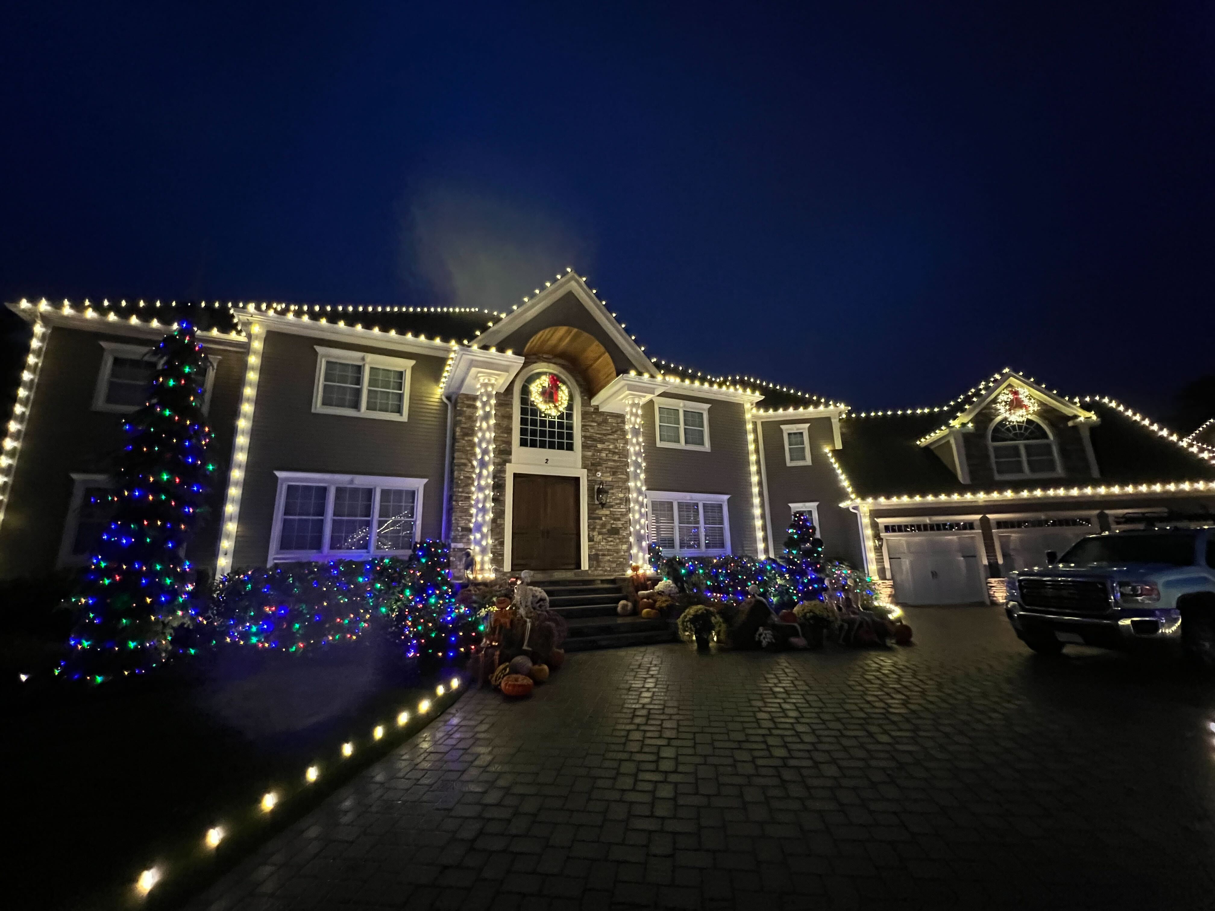 A picture of a house with christmas lights