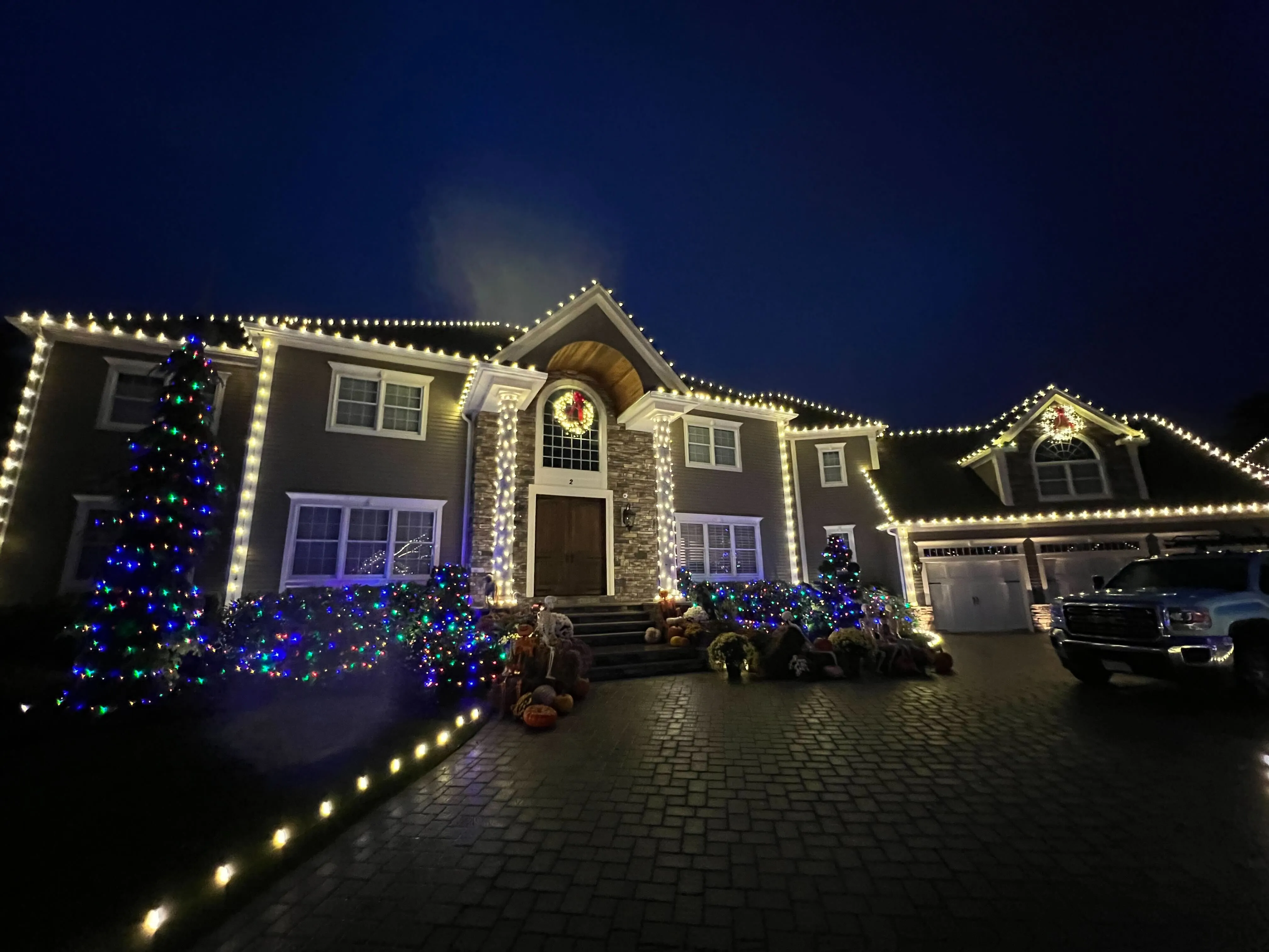 A picture of a house with christmas lights