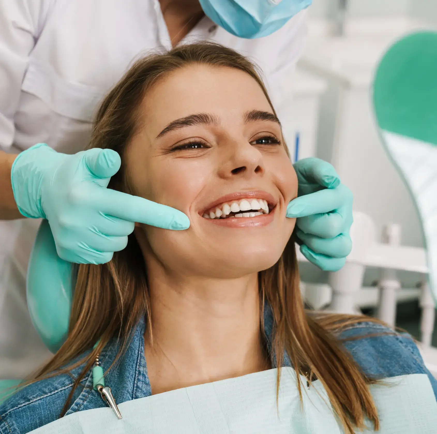 A woman getting her teeth checked by a dentist.