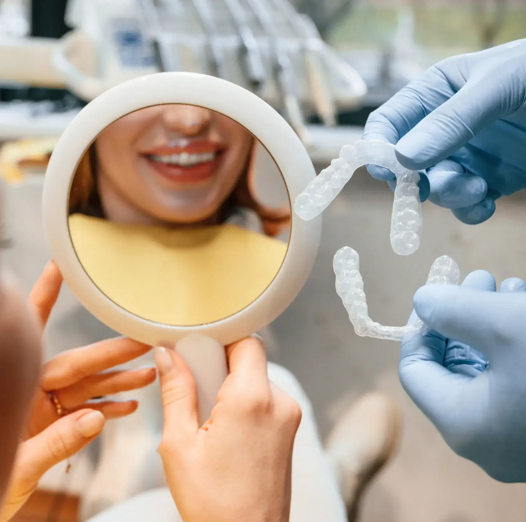 A woman getting her teeth checked by a dentist.