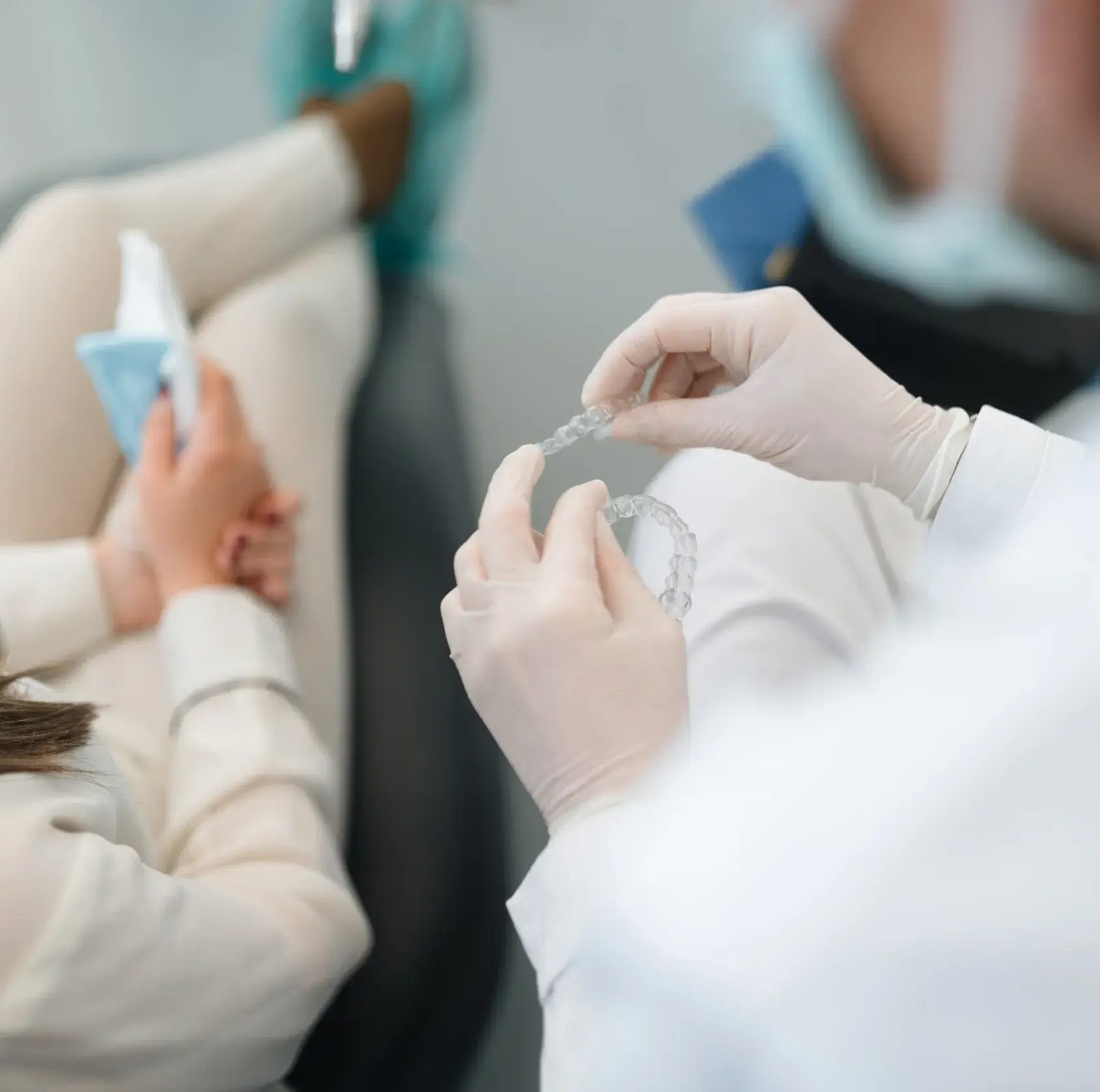 A woman getting her teeth checked by a dentist.