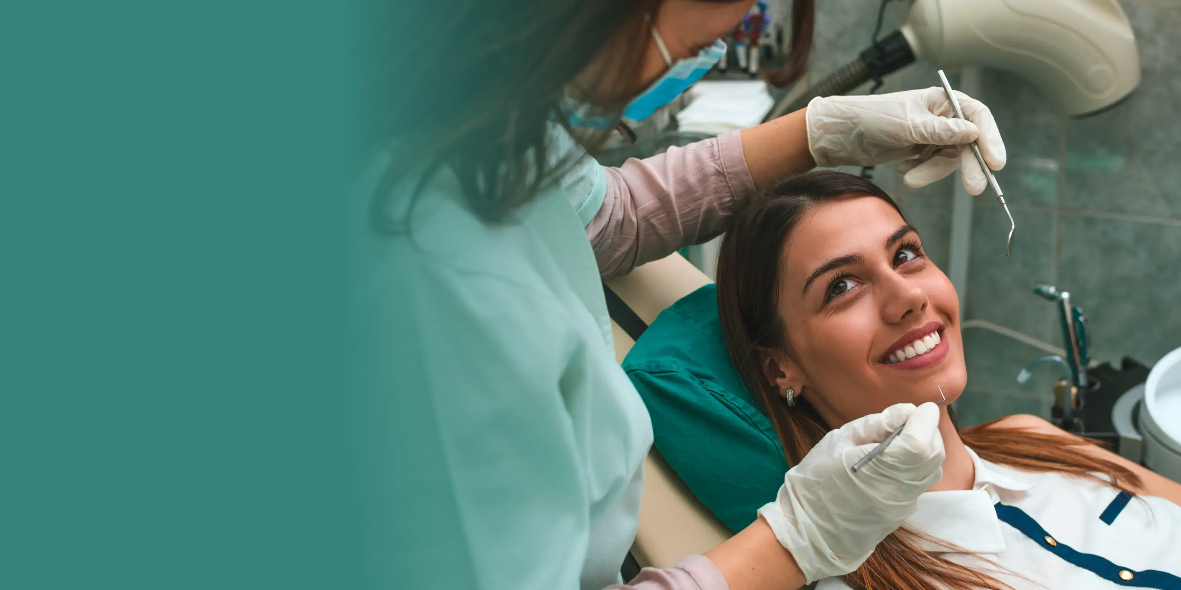 A woman getting her teeth checked by a dentist.