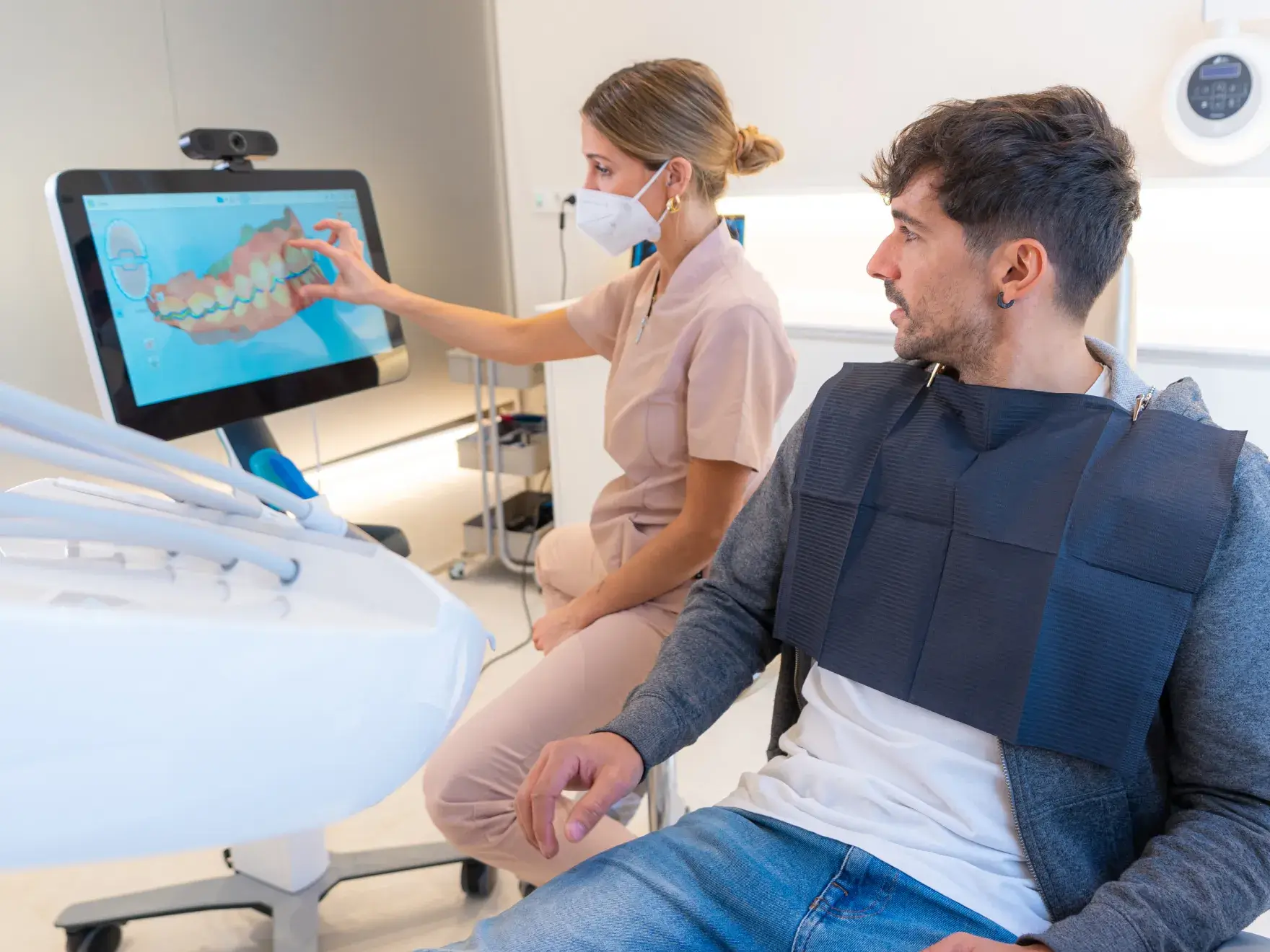 A man and a woman in a dental room.