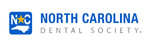 The north carolina dental society logo.