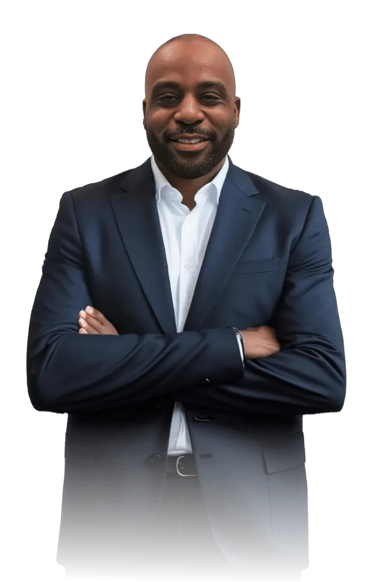 Richard Ighodaro wearing a suit and tie is smiling.