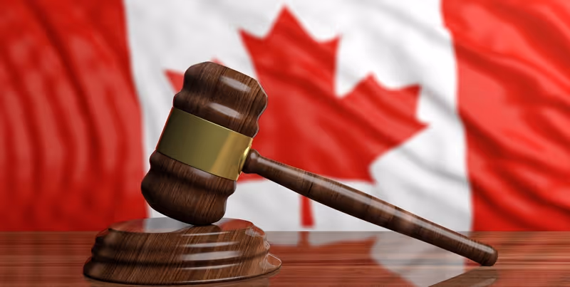 Canadian flag and judge gavel representing PIPEDA enforcement and privacy law compliance in Canada