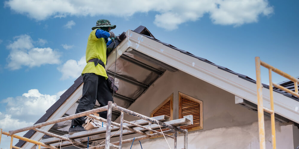 Home builder in yellow suit