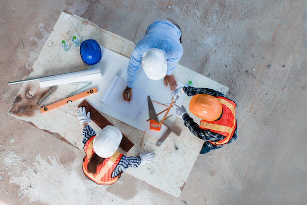 Birdseye view of a team of three on a construction site