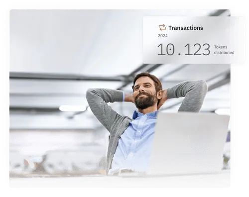 Man sitting behind laptop