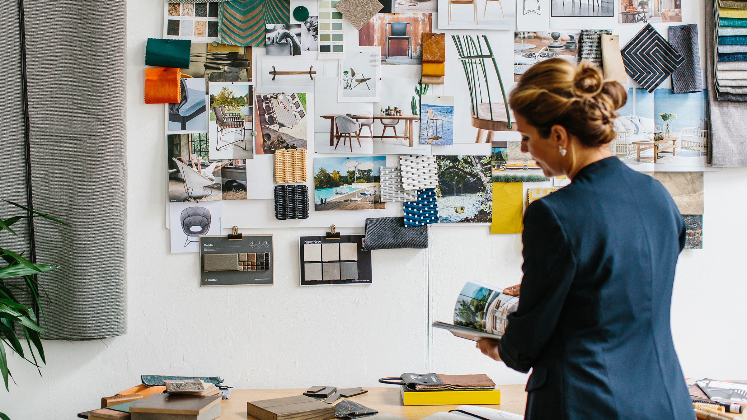 Woman standing in front of furniture moodboard