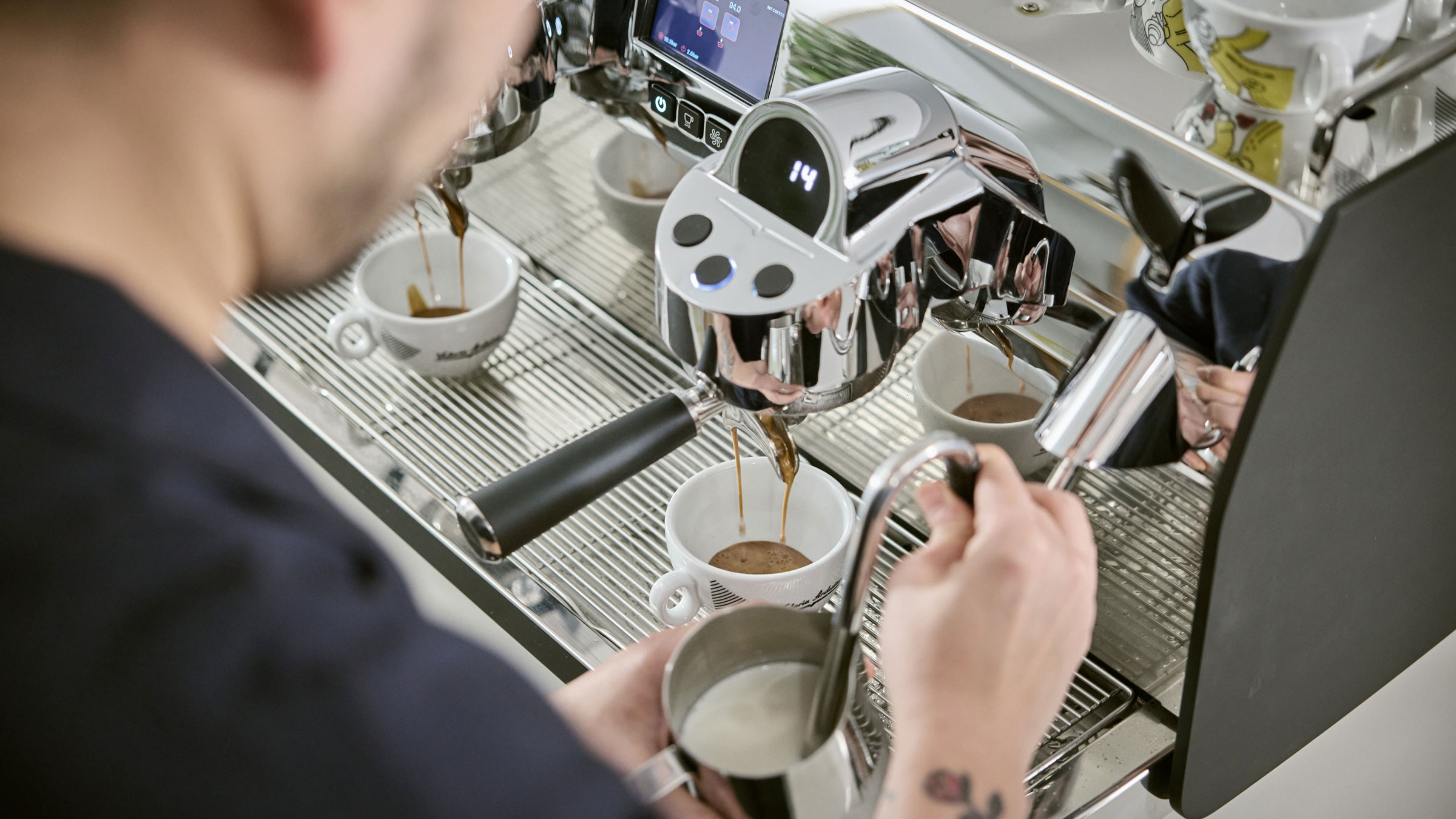 Mikale Jasin steaming mily on Eagle Core coffee machine