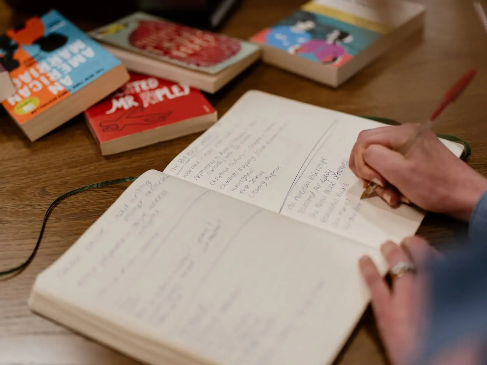 Someone writing in a book