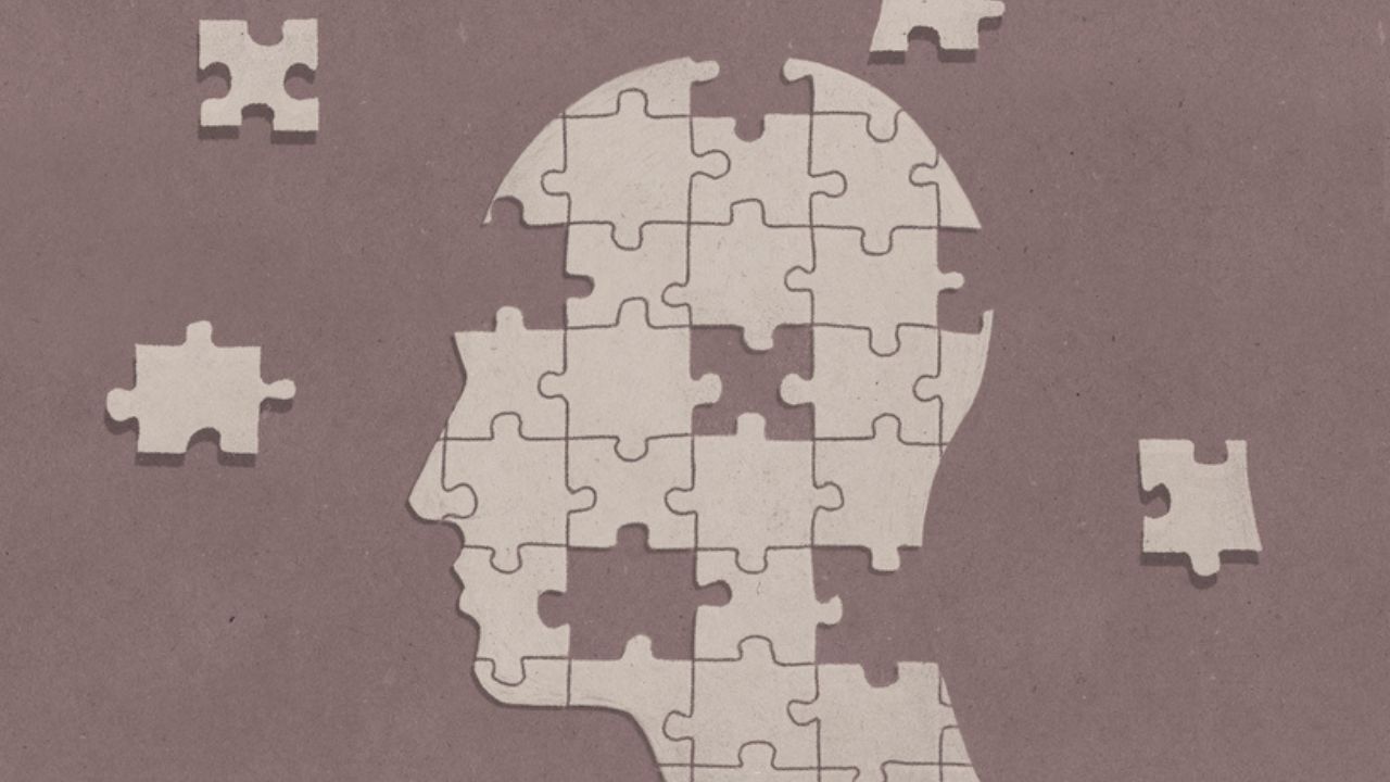 illustration of a silhouette of a person's profile made up of jigsaw pieces