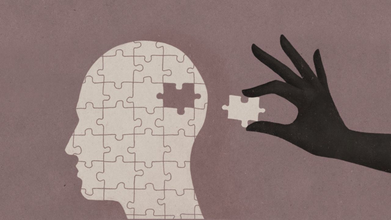 illustration of a hand inserting the final piece of the jigsaw puzzle of the person's profile