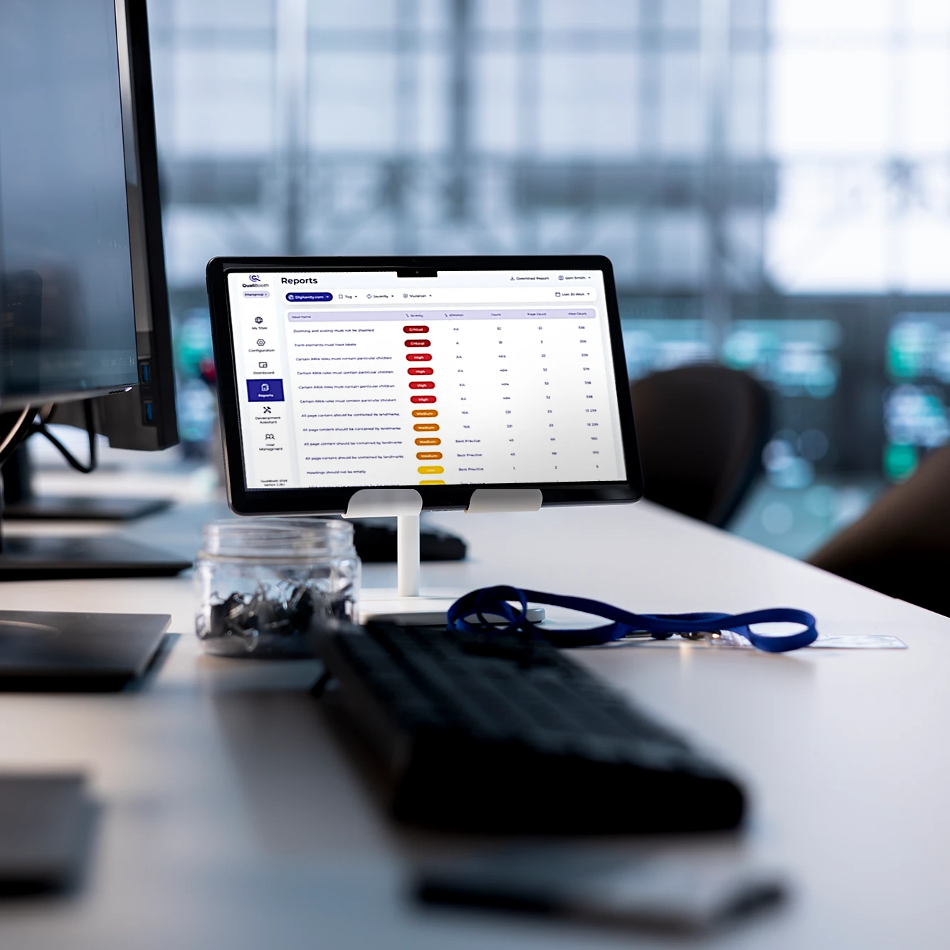 Tablet displaying an accessibility report dashboard with issues and status indicators.