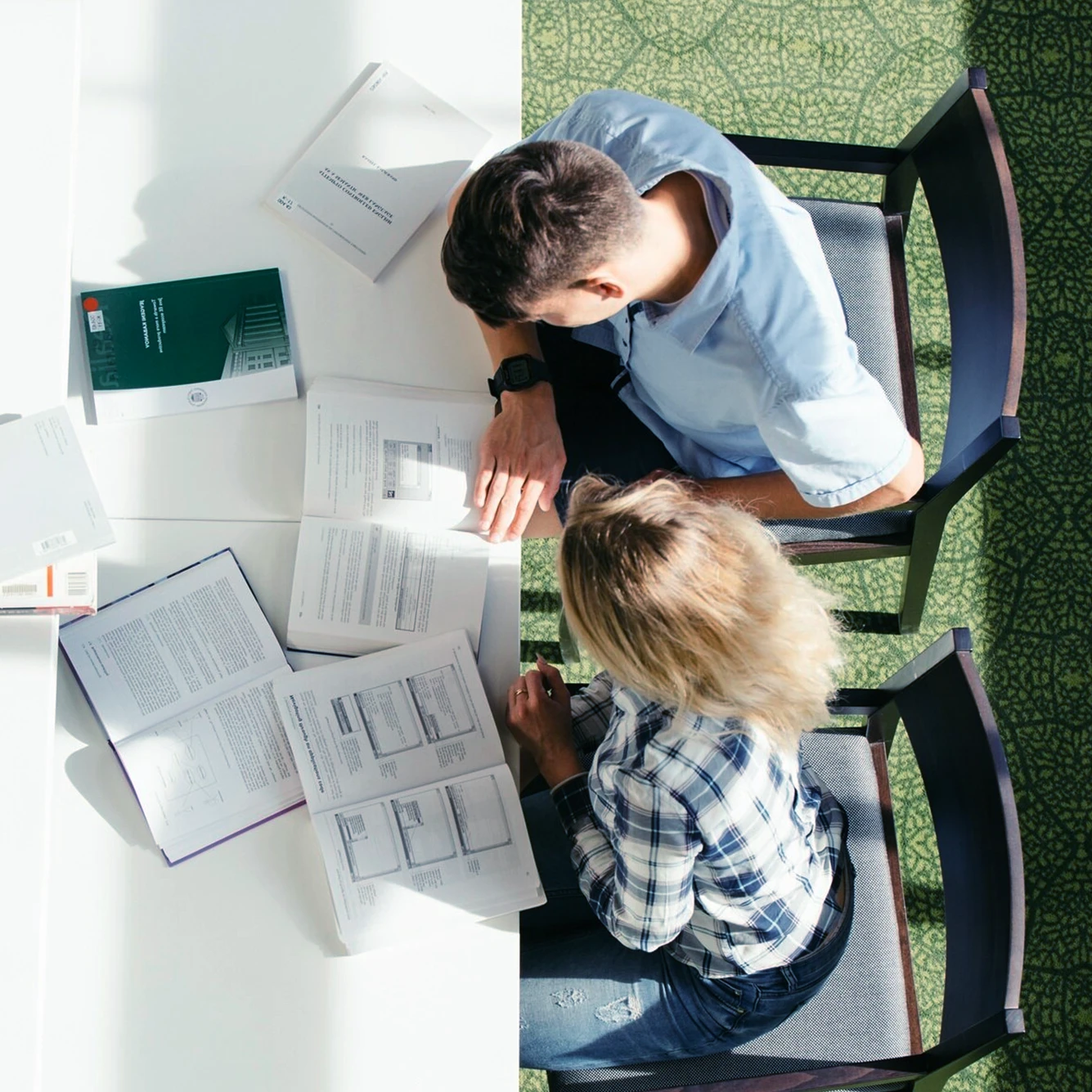 Students studying together at a table.