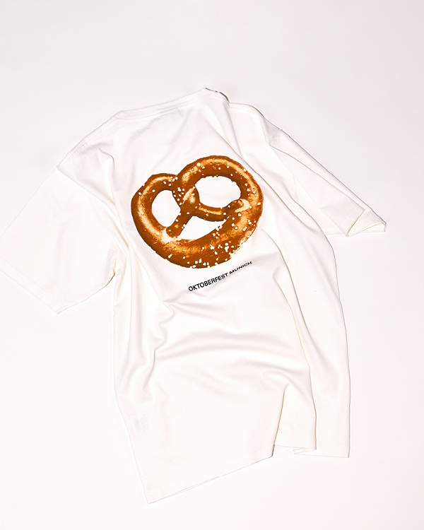 White t-shirt with a large pretzel graphic and 'Oktoberfest Munich' text printed below on the back.