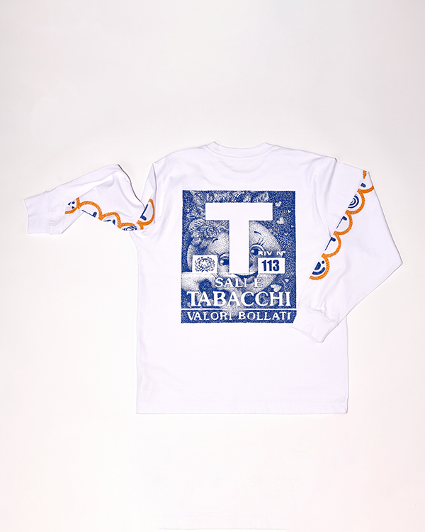 White long-sleeve shirt with blue and orange decorative patterns on sleeves and a blue graphic on the back featuring text and an illustrated face.