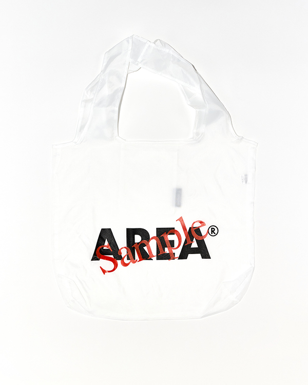 White reusable tote bag with black bold text 'ADELA' and a red diagonal 'Sample' watermark.