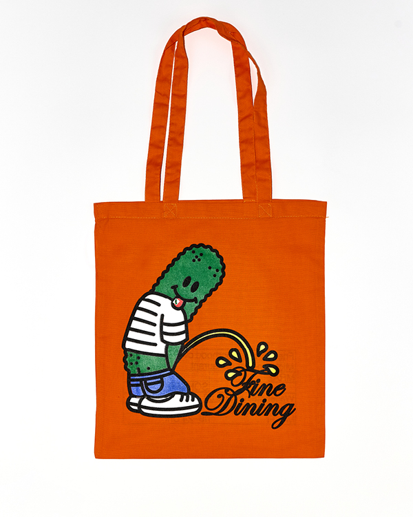 Orange tote bag featuring a cartoon pickle character wearing a striped shirt and sneakers, peeing the words 'Fine Dining.'