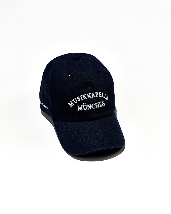 Navy blue baseball cap with white embroidered text 'Musikkapelle München' on the front.