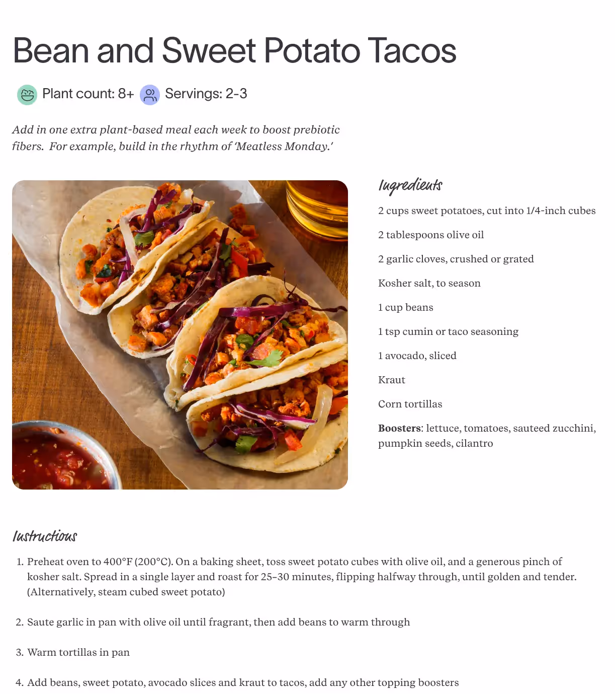 Bean and sweet potato tacos recipe with corn tortillas filled with roasted sweet potatoes, beans, avocado, and kraut, served with salsa.