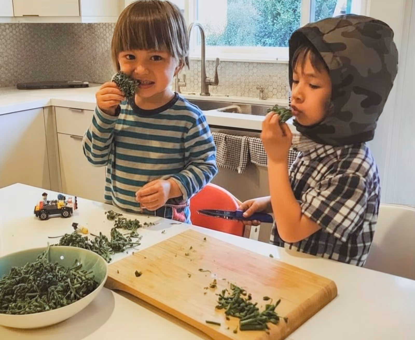 Amy's kids, Austin, age 3, and Brayden, age 5, in the kitchen helping prep veggies 