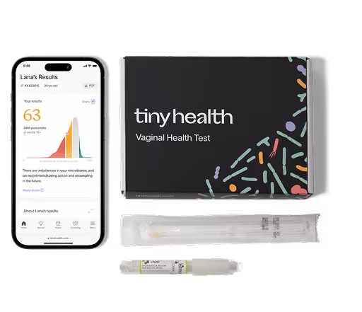 The contents of a Vaginal Health Test from Tiny Health including a swab for samples and prepaid mailers.