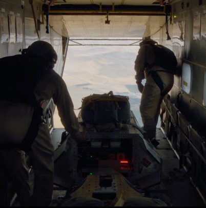 Crew loading a payload aboard an aircraft during an Inversion mission