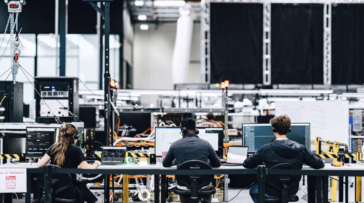 K2 Space engineers monitoring live test telemetry on the production floor