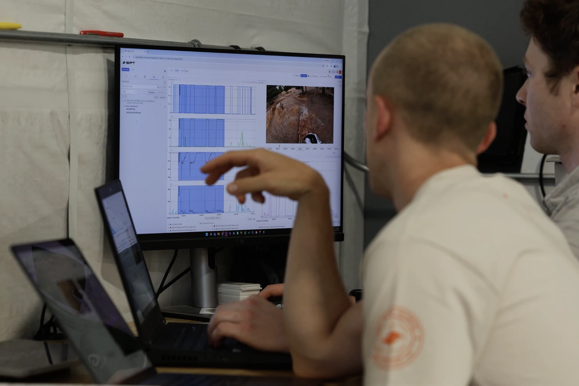 Dust Moto engineers reviewing ride data in Sift in their workshop