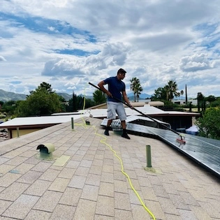 Alex's Tucson window cleaning business, taking on a solar panel job