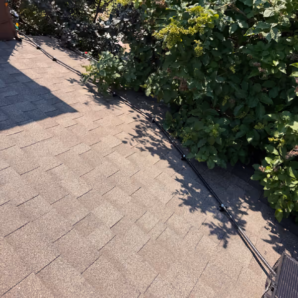 Example of poorly routed exterior solar cabling across a roof