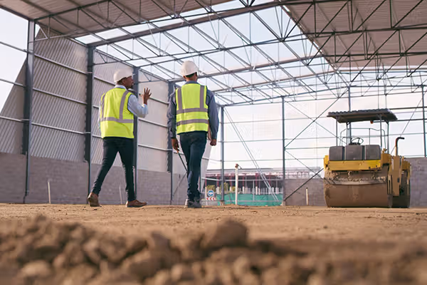 Two contractors walking and talking
