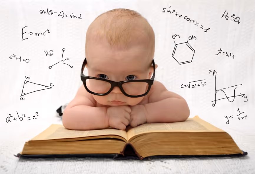 Baby wearing oversized black glasses lying on an open book with math and science formulas around.