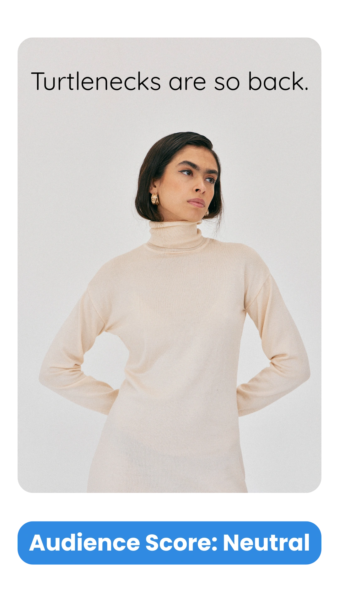 Minimalist fashion ad showing a woman in a beige turtleneck sweater and gold hoop earrings against a light background. Text reads "Turtlenecks are so back." Audience analysis score: Neutral.
