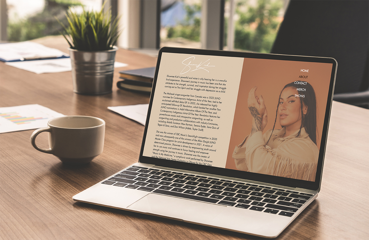 A laptop computer featuring Shawnee Kish's about page.