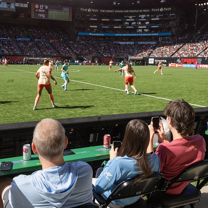 Photo of Portland Thorns fans sitting pitchside