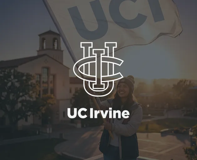 Person smiling and holding a large UCI flag with campus buildings and sunset in the background, with UC Irvine logo overlay.