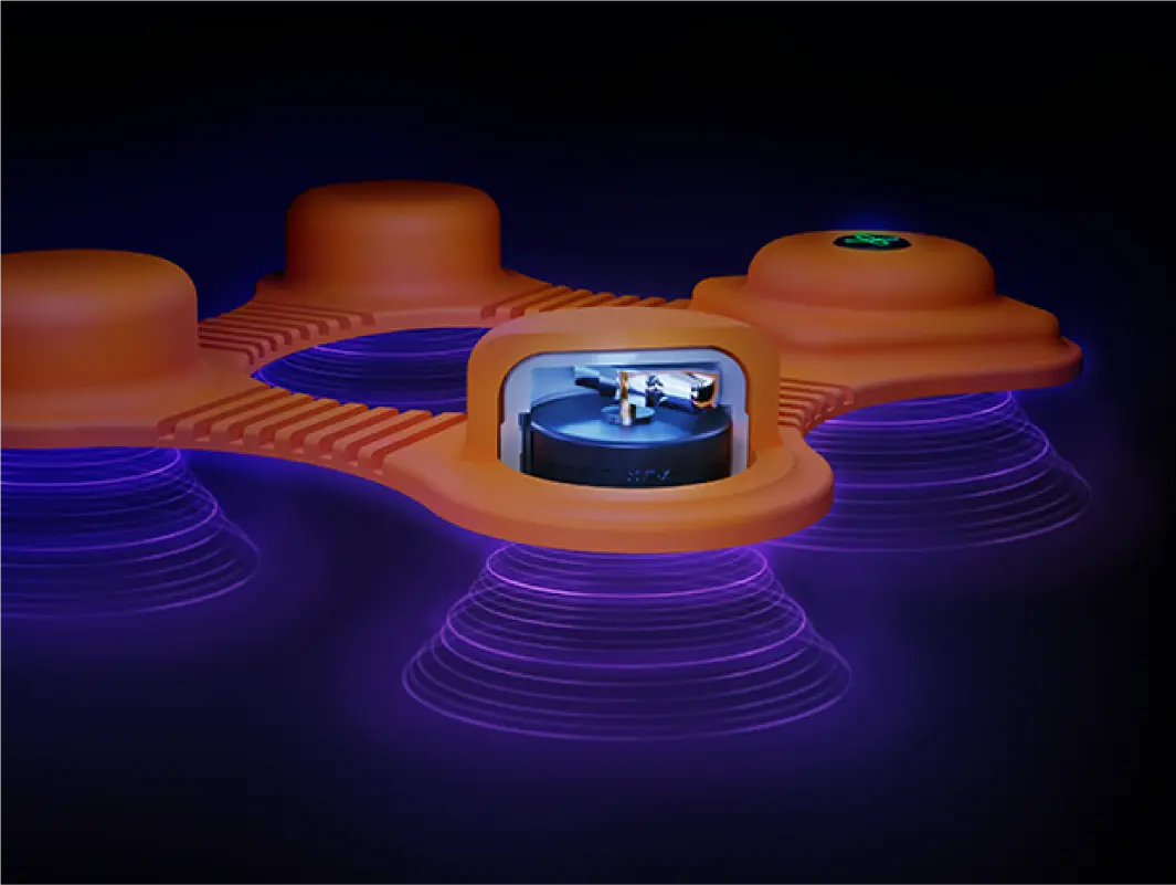 Close-up 3D rendering of an orange muscle vibration device emitting concentric purple waves, with one part cut open to show an internal motor spinning.