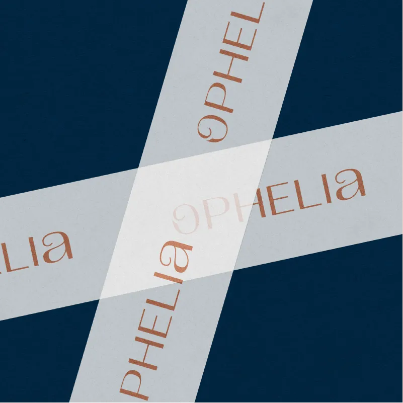 Luxury jewelry brand identity collateral for Ophelia, showcasing white ribbons with a rose gold metallic foil logo layered over a sophisticated dark navy background.