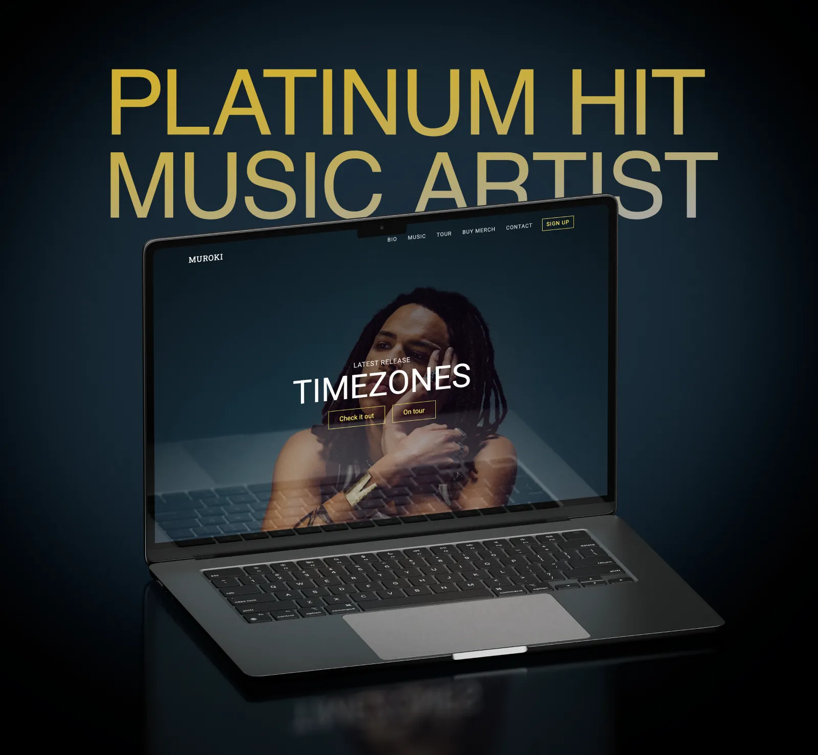 Laptop screen showing a music artist Muroki's website with a portrait of Muroki with dreadlocks and text reading 'LATEST RELEASE TIMEZONES' on the homepage and behind the laptop says 'PLATINUM HIT MUSIC ARTIST'.