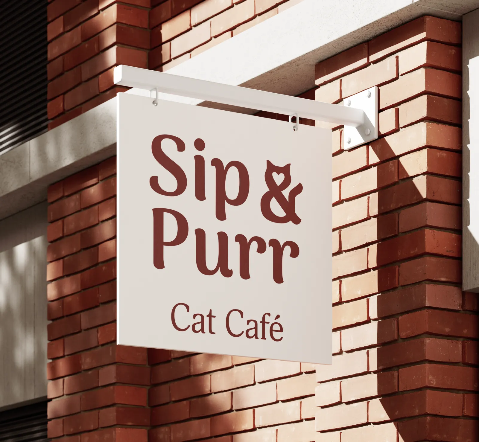 Sip & Purr cat café logo on a white square hanging sign mounted on a red brick wall.