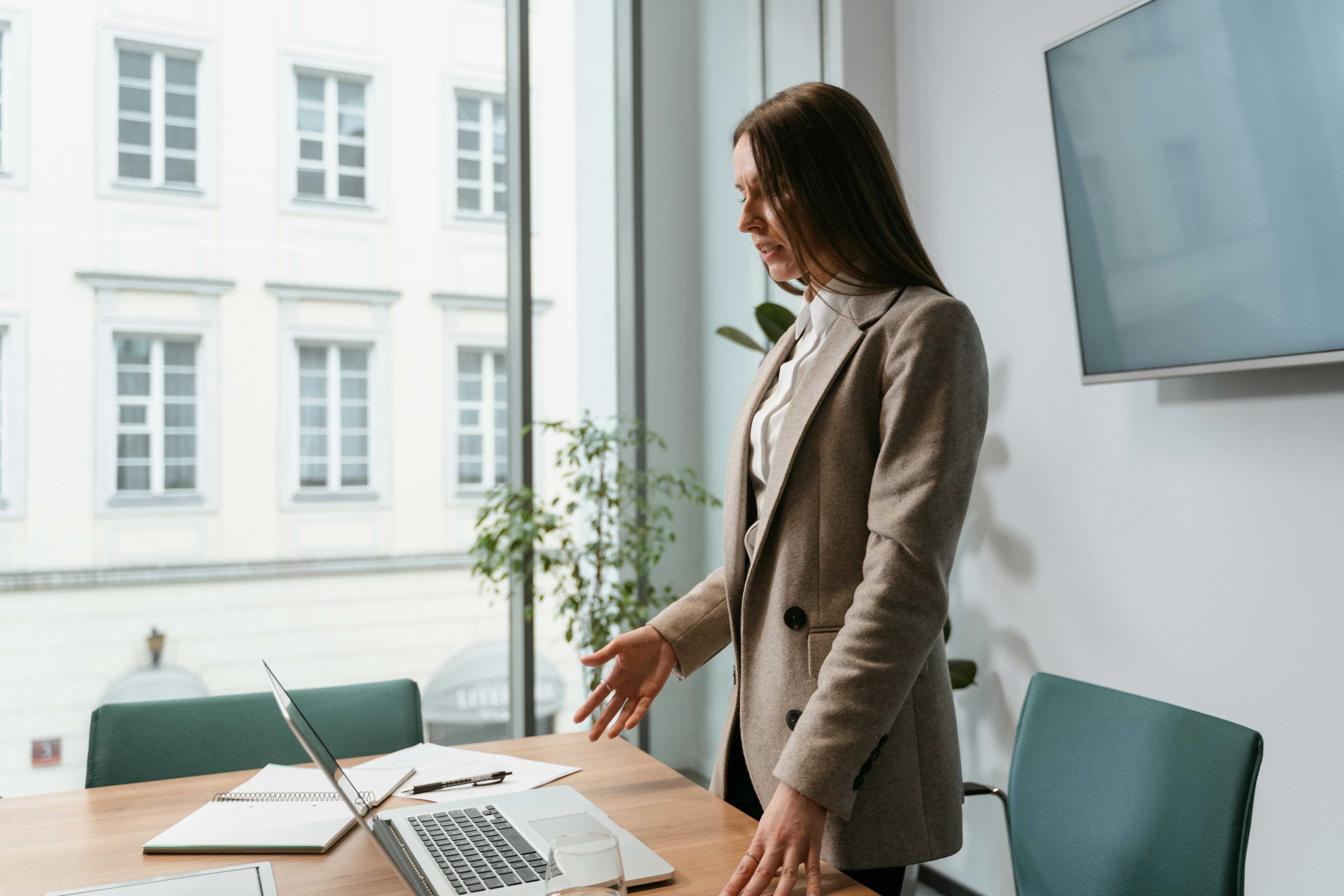 Group of diverse business professionals having a discussion in a modern office, illustrating fractional sales leadership in action, supporting scalable growth without full-time overhead.