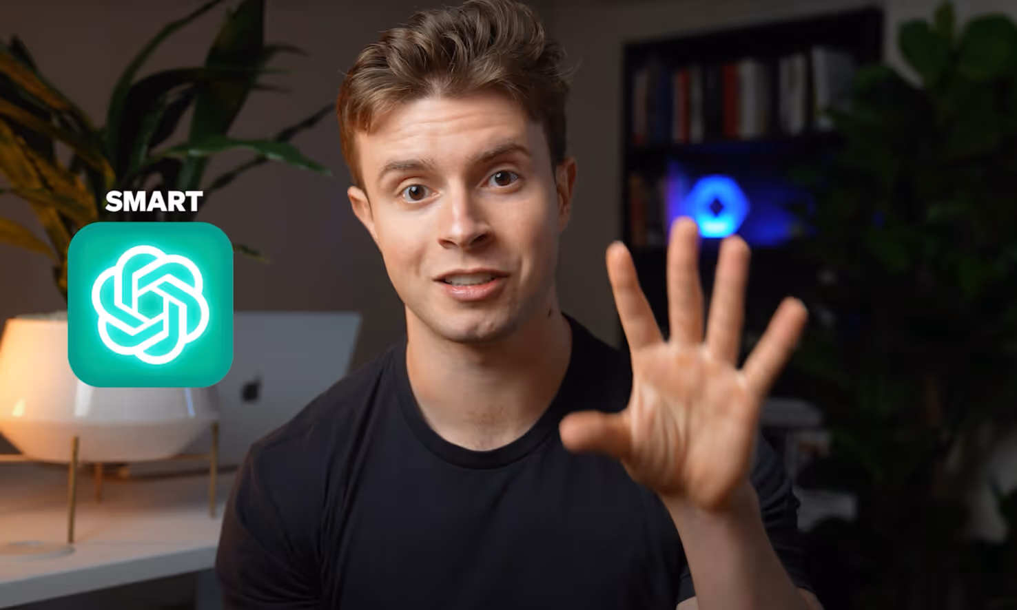 Young man in a black shirt waving with a neon green OpenAI logo and the word SMART beside it.