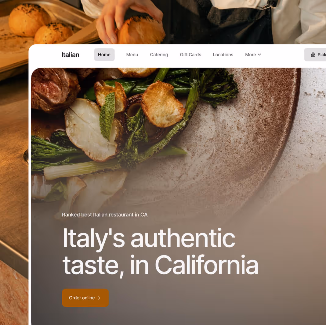Close-up of a plated Italian dish with roasted vegetables, green beans, and meat, with a hand holding a bread roll above the plate.