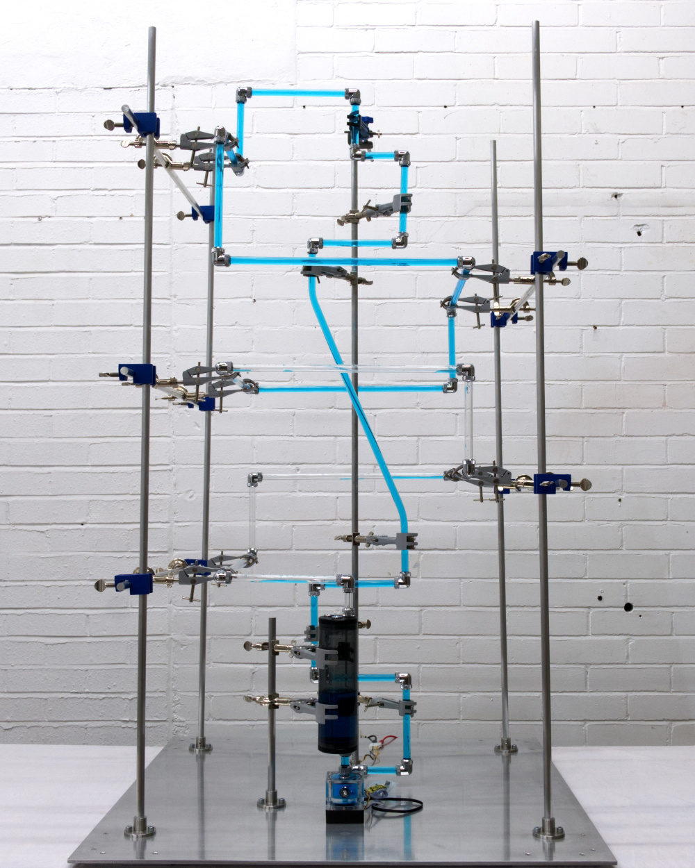 Kinetic pipe work sculpture programmed using sewage release data.