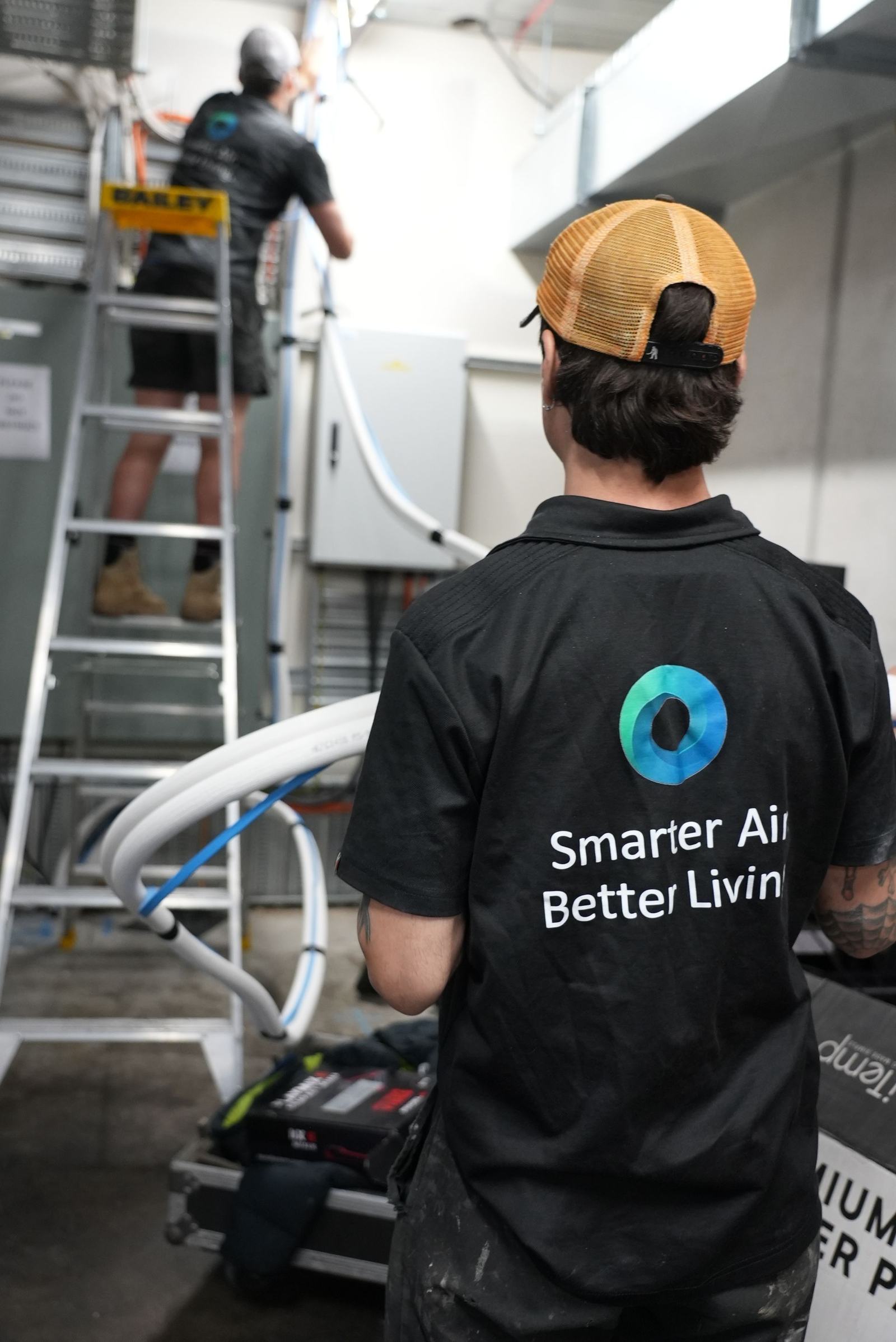 Oz Air Group technician on a rooftop ducted air conditioning install in Melbourne