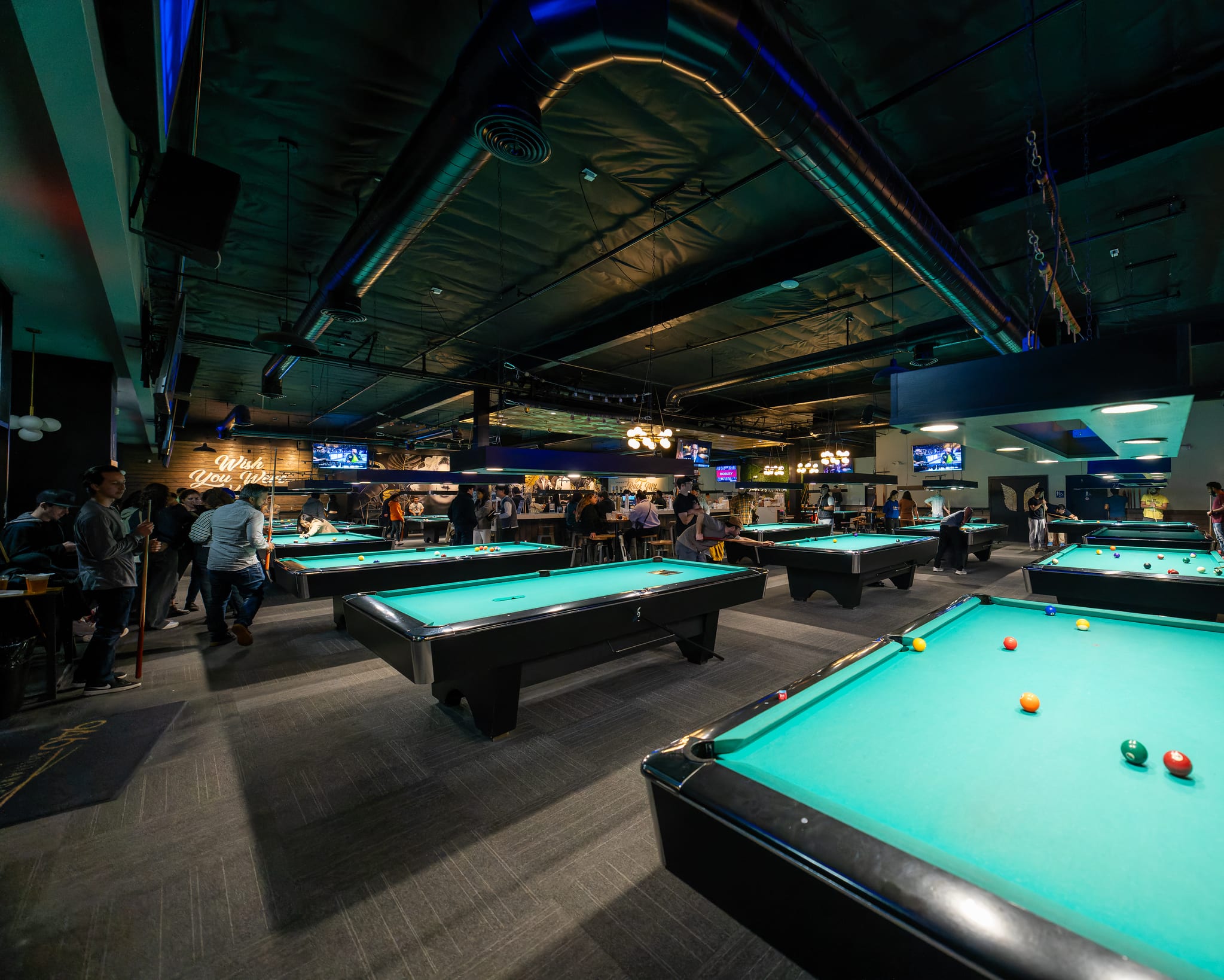 The main floor of Gandy pool tables at 946 Billiards